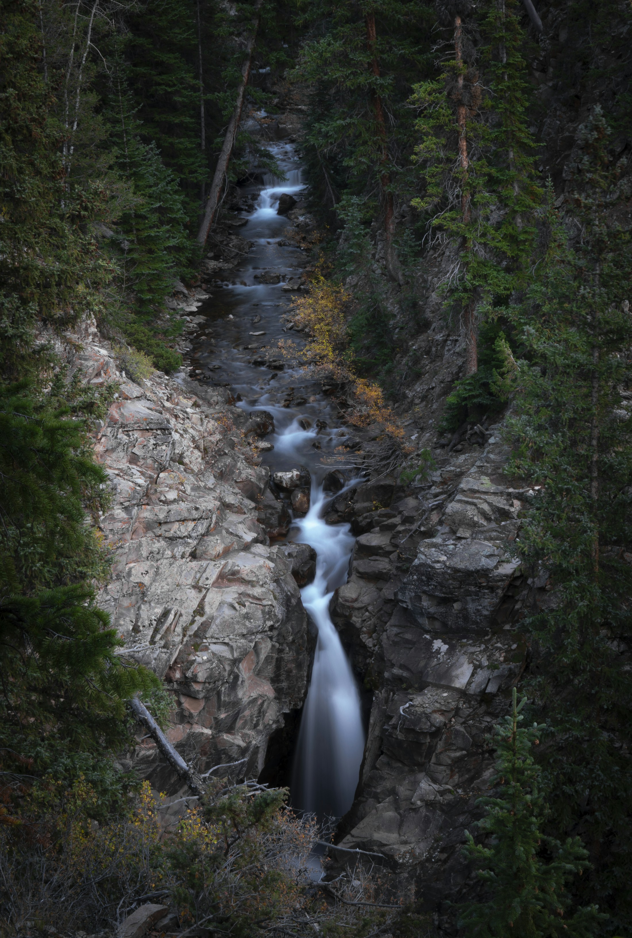 A clear mountain river running through stone and open air