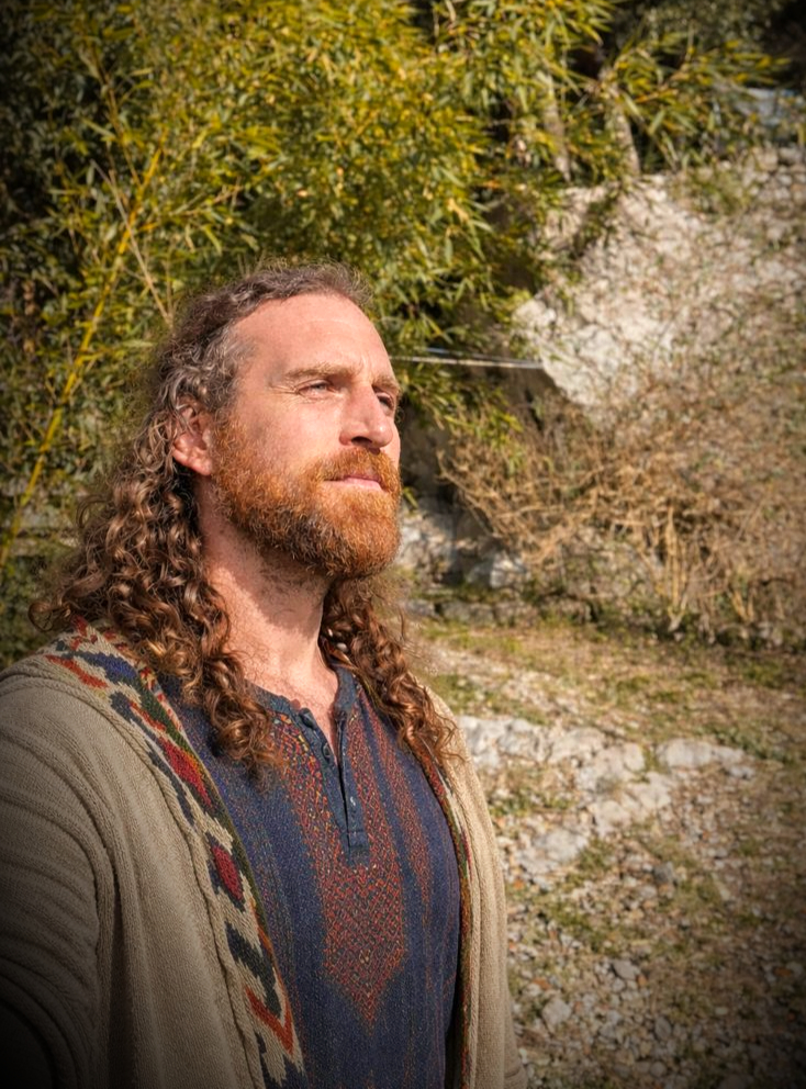 Ruben Carpentier standing outdoors in warm mountain light