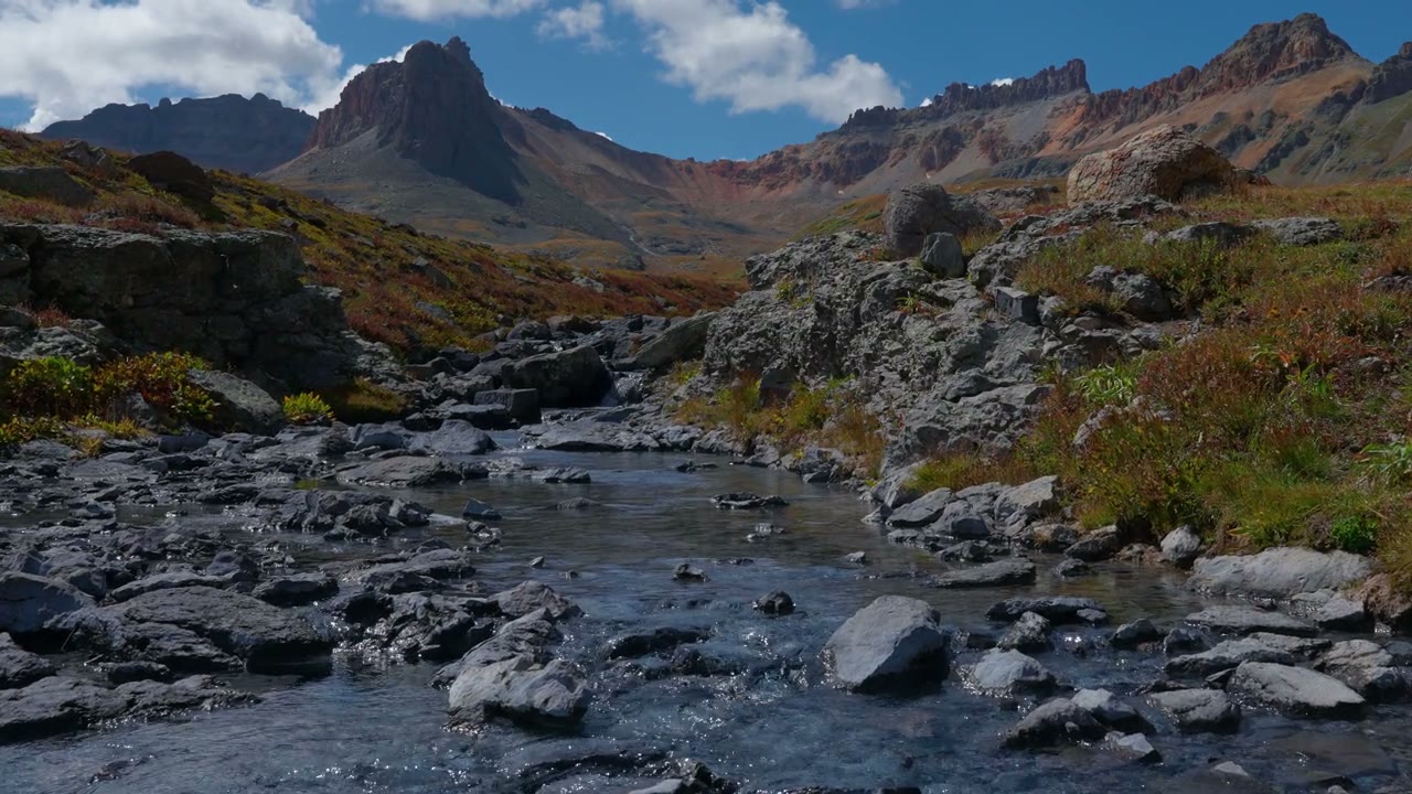 A mountain stream moving through a quiet landscape